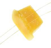 Pulling thread through wax